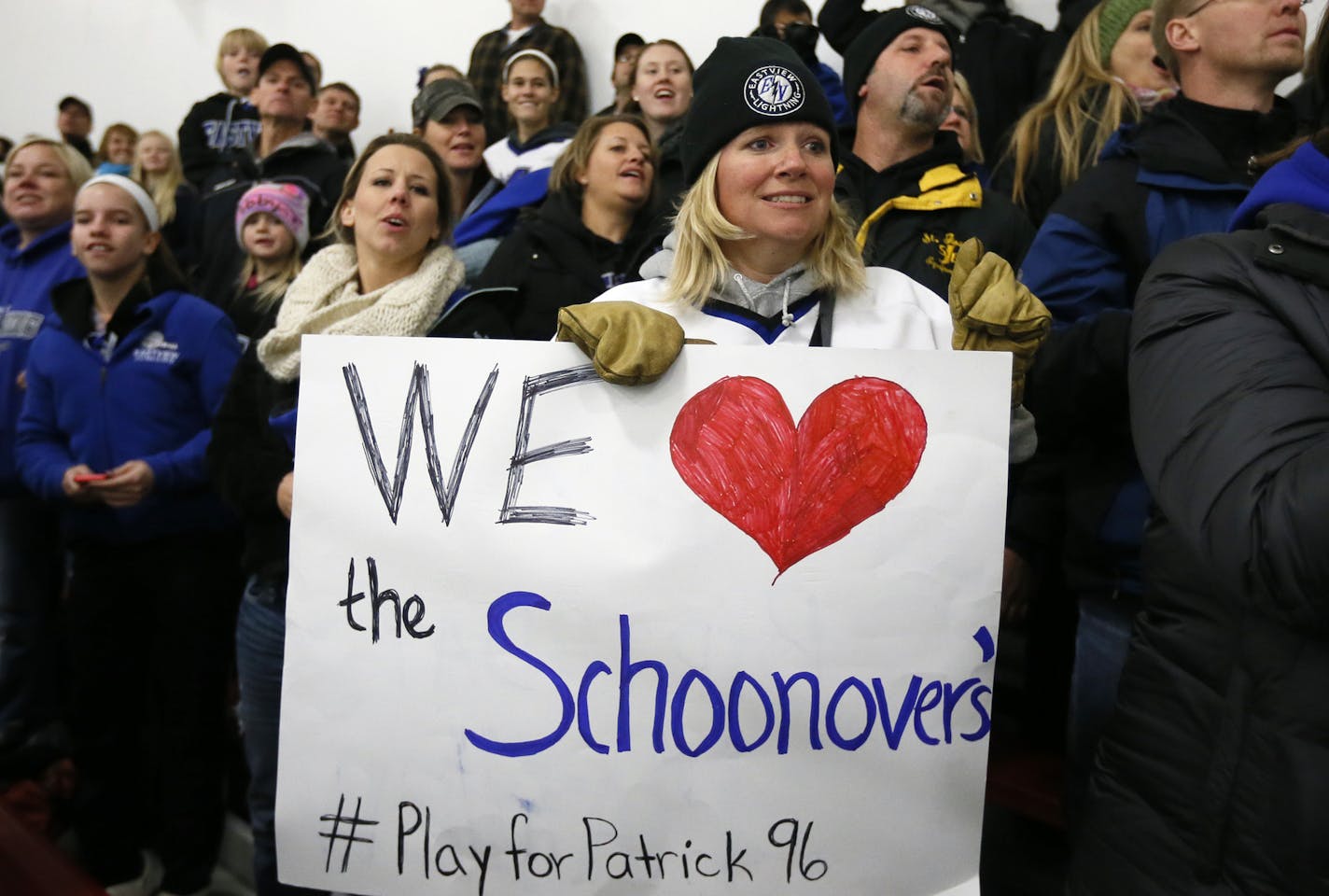 Erin Mathews a hockey mom and coach along with the Easterview community showed their support of Patrick Schoonover's family during a scrimmage game at Hayes Arena Sunday November 16, 2014 in Apple Valley, MN. ] Jerry Holt Jerry.holt@startribune.com