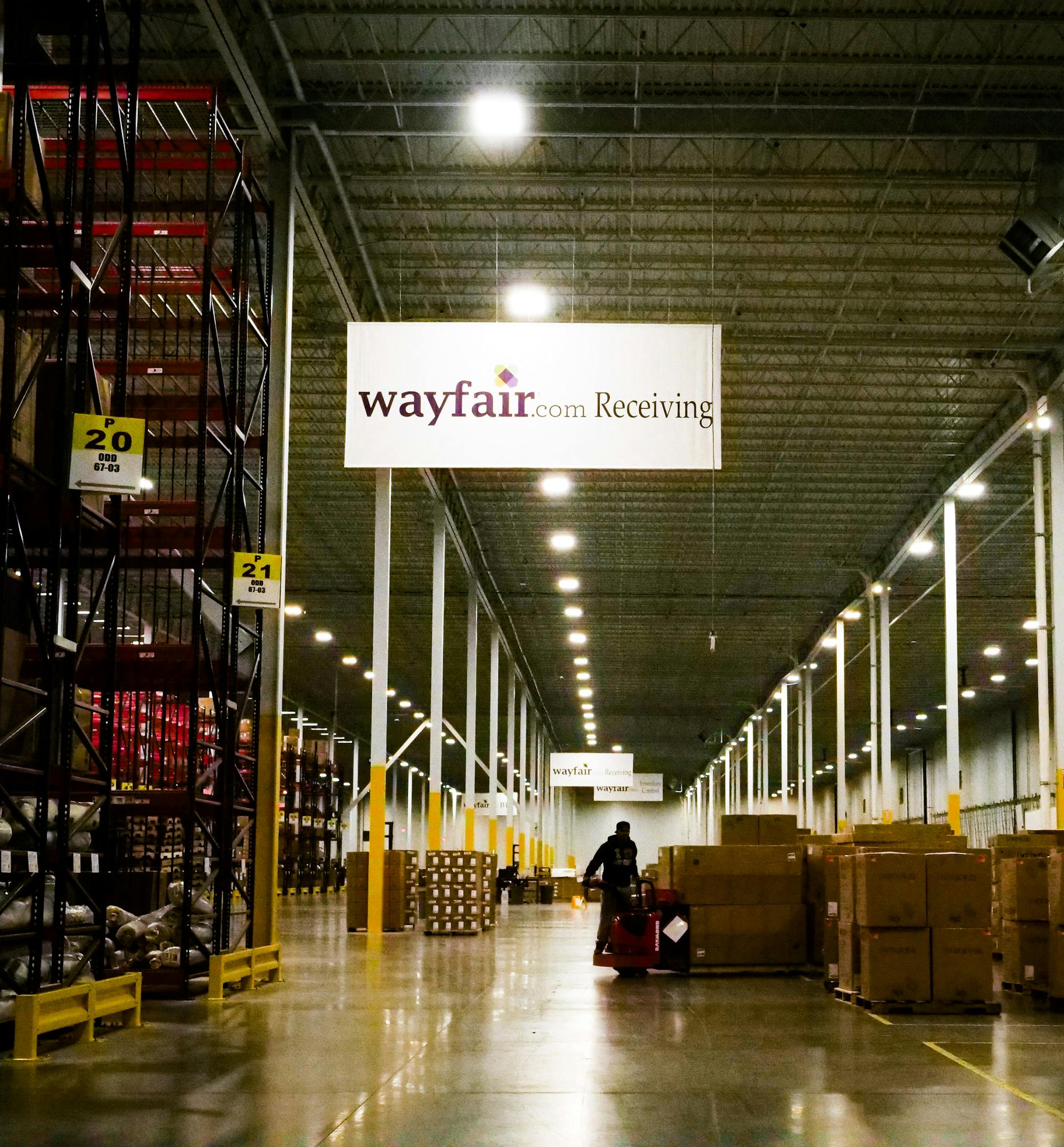 FILE-- A worker inside the Wayfair distribution center in Cranbury, N.J., April 13, 2017. Internet retailers can be required to collect sales taxes in states where they have no physical presence, the Supreme Court ruled on June 21, 2018. State officials in South Dakota sued three online retailers, including Wayfair, for violating a law that required merchants to collect sales tax. (John Taggart/\ The New York Times)