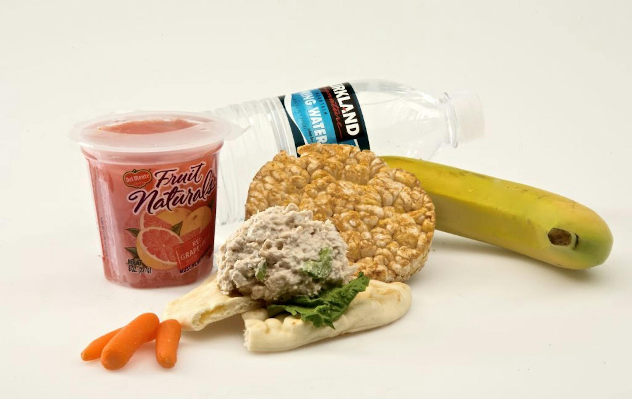 Story on what kind of lunch to pack for your child when they go off to camp. Tuna salad on pita withf lettuce Banana Grapefruit sections Carrots Rice Cakes Water