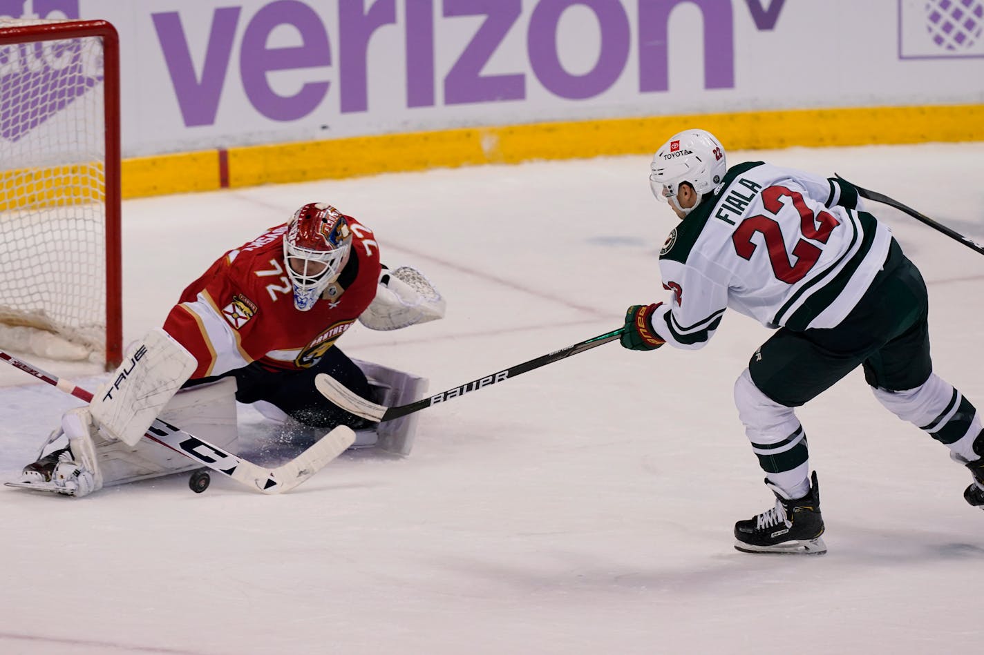 Florida Panthers goaltender Sergei Bobrovsky (72) stops a shot on goal by Minnesota Wild left wing Kevin Fiala (22) during the second period at an NHL hockey game, Saturday, Nov. 20, 2021, in Sunrise, Fla. (AP Photo/)