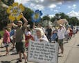 Tenants and their supporters marched to Our Lady of Peace Church in south Minneapolis on July 14 to oppose the efforts by landlord Stephen Frenz to ev