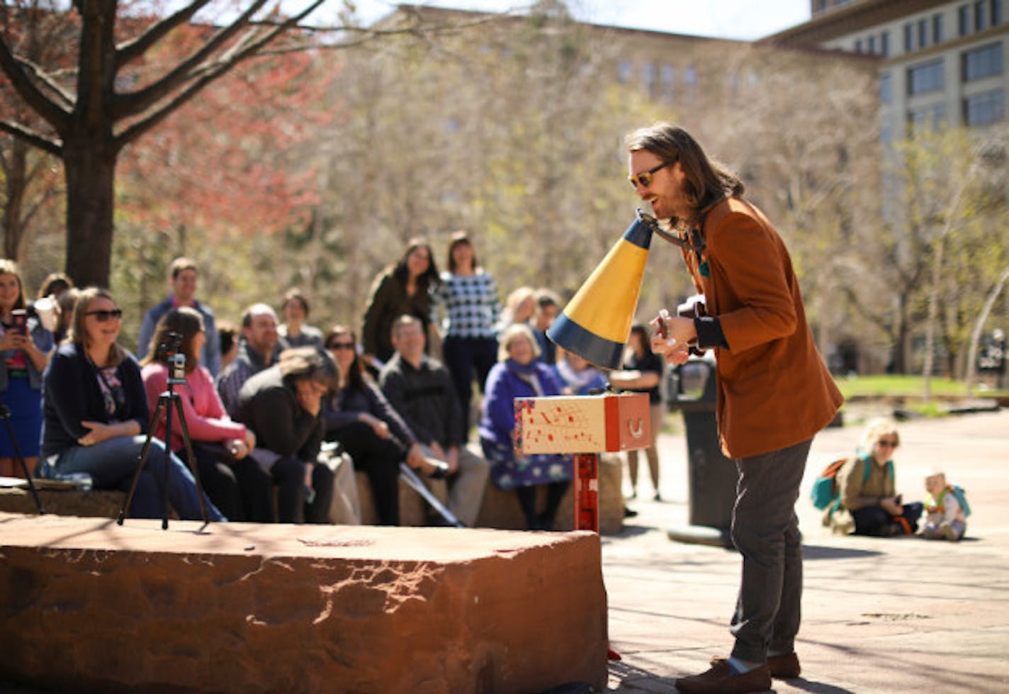 Jeremy Messersmith set up shop in St. Paul's Mears Park at lunchtime Monday for the second stop on his "micro-tour." / Jeff Wheeler, Star Tribune