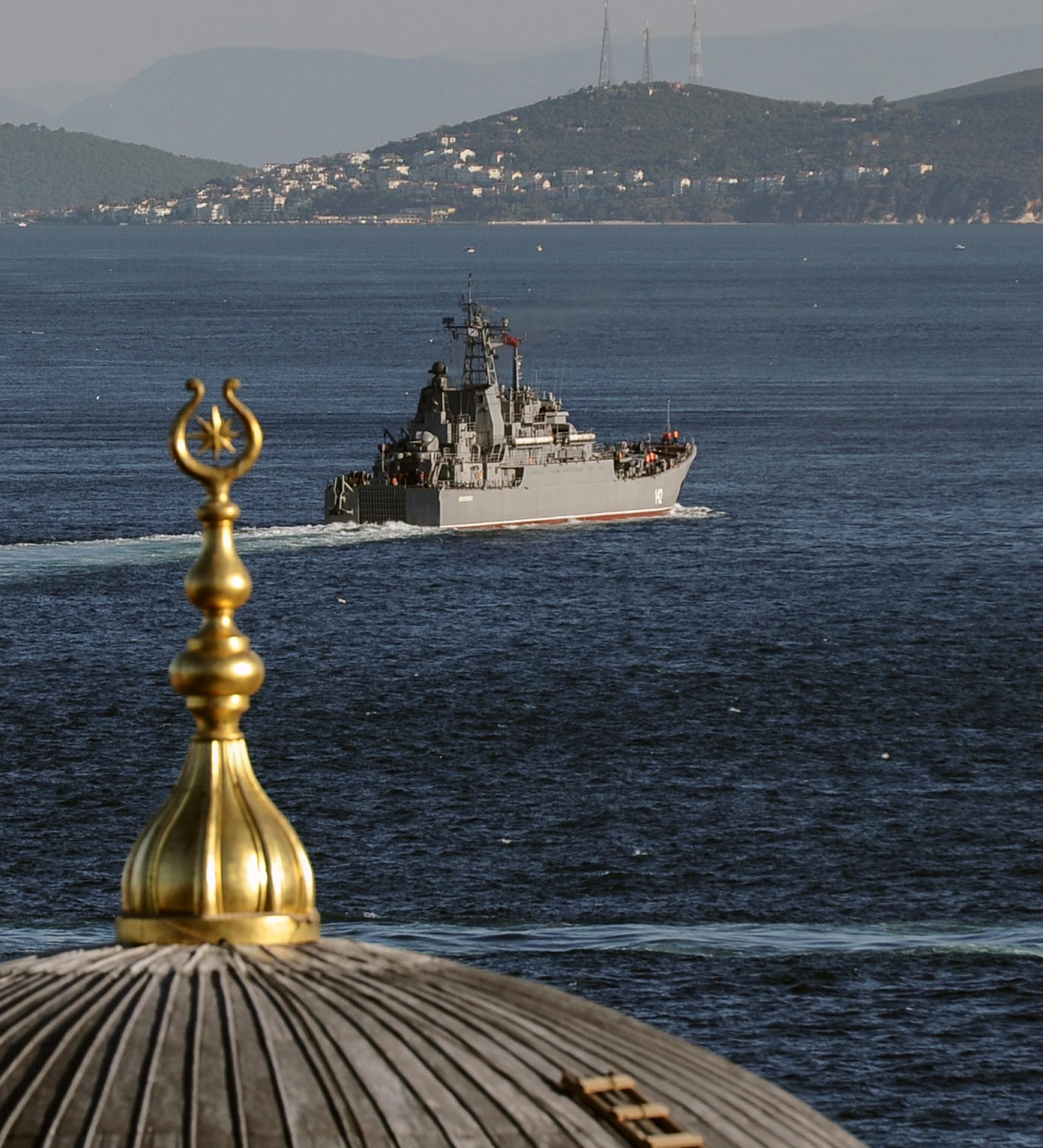 A Russian warship sails through the Bosporus in Istanbul, Turkey, Thursday, Sept. 5, 2013. A group of Russians warships are en route to the East Mediterranean.(AP Photo)