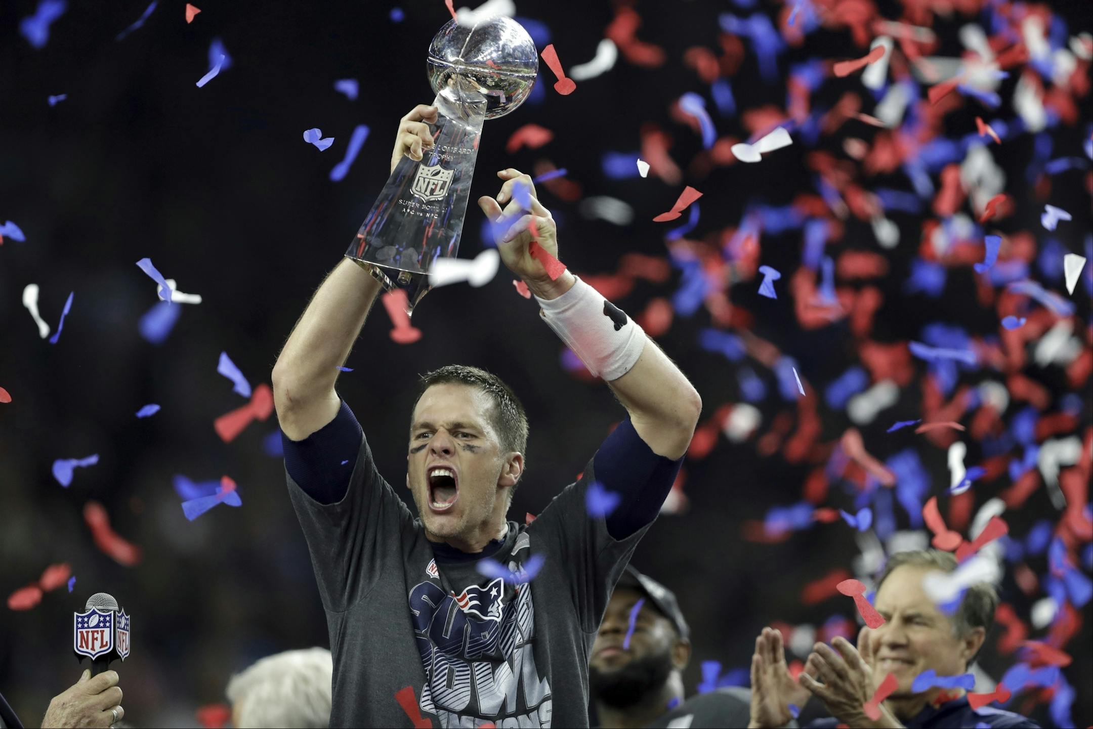 2017 AP YEAR END PHOTOS - New England Patriots' Tom Brady raises the Vince Lombardi Trophy after defeating the Atlanta Falcons in overtime at the NFL Super Bowl 51 football game on Feb. 5, 2017, in Houston. The Patriots defeated the Falcons 34-28. (AP Photo/Darron Cummings) ORG XMIT: NYYE266