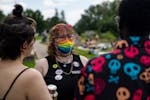 Ly Baumgardt talks with friends during a TIGERRS Mondo Queer Beach Party at Lake Nokomis Little Beach on Sunday. Baumgardt is the Intersex Services Co