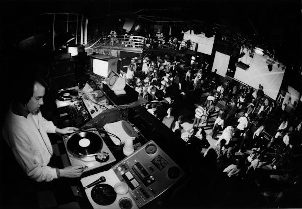 A deejay spins the records at First Avenue (rock music nightclub) in downtown Minneapolis. February 1988 photo by Star Tribune staff photographer Davi