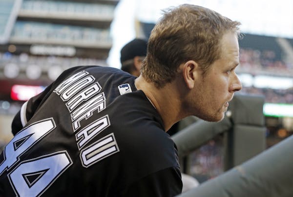 Former Minnesota Twins player Justin Morneau waits to bat in the fourth inning during his return to Target Field as a Chicago White Sox designated hit