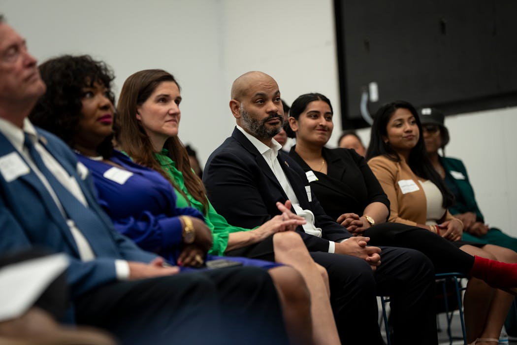 From left, Council Members Michael Rainville, LaTrisha Vetaw and Linea Palmisano, Council President Elliott Payne, Council Vice President Aisha Chughtai, and Council Members Aurin Chowdhury and Andrea Jenkins listen to Mayor Jacob Frey give the State of the City speech at the Northstar Center in Minneapolis on Tuesday.