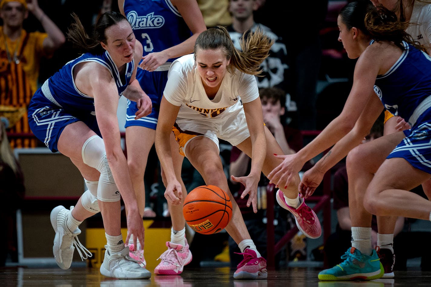 Gophers guard Mara Braun clamored over the ball during the second overtime against Drake on Saturday.