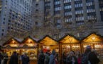 People walk around Daley Center Plaza on opening day of Christkindlmarket on Nov. 15, 2019 in Chicago. (Camille Fin /Chicago Tribune/TNS) ORG XMIT: 30