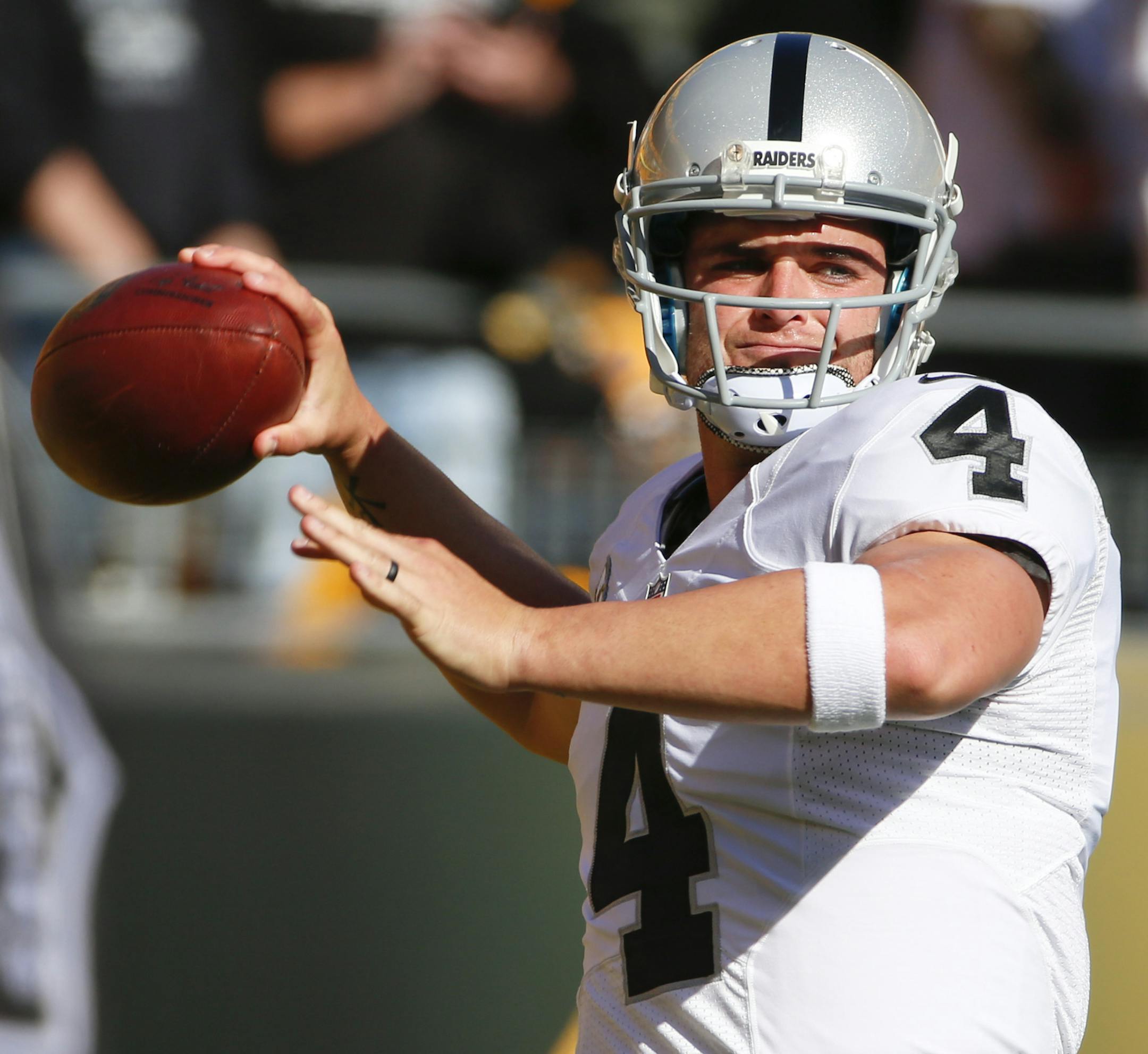 Oakland Raiders quarterback Derek Carr (4) warms up before an NFL football game against the Pittsburgh Steelers, Sunday, Nov. 8, 2015, in Pittsburgh. (AP Photo/Gene J. Puskar) ORG XMIT: PAKS