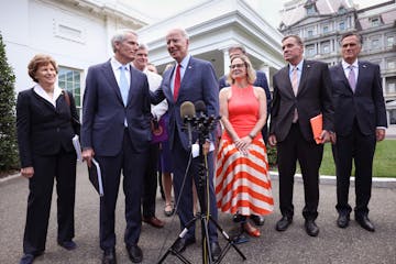 President Joe Biden with senators in June after the bipartisan group reached a deal on infrastructure spending. The measure is stuck in the House.