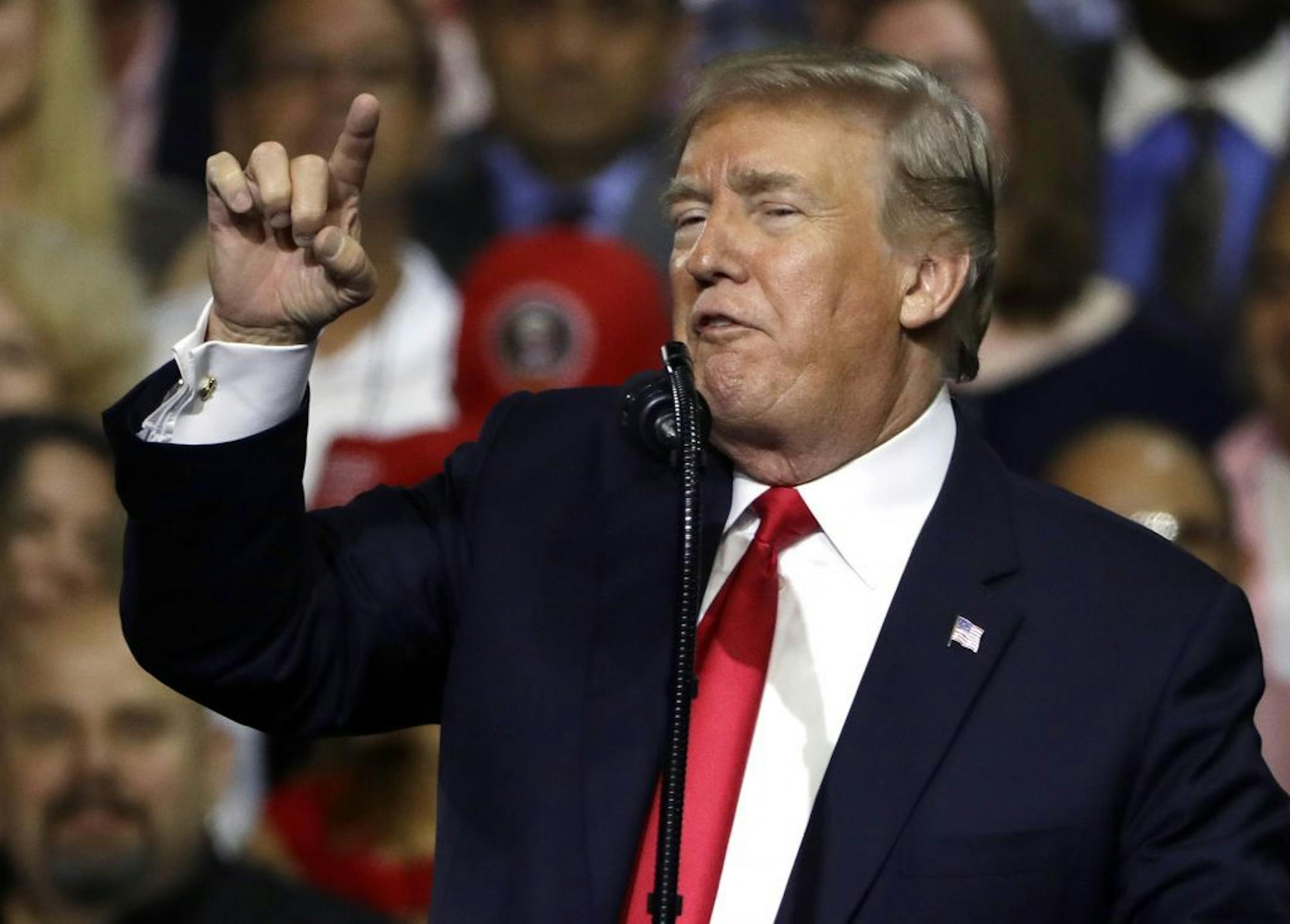 President Donald Trump gestures during a rally Tuesday, July 31, 2018, in Tampa, Fla.