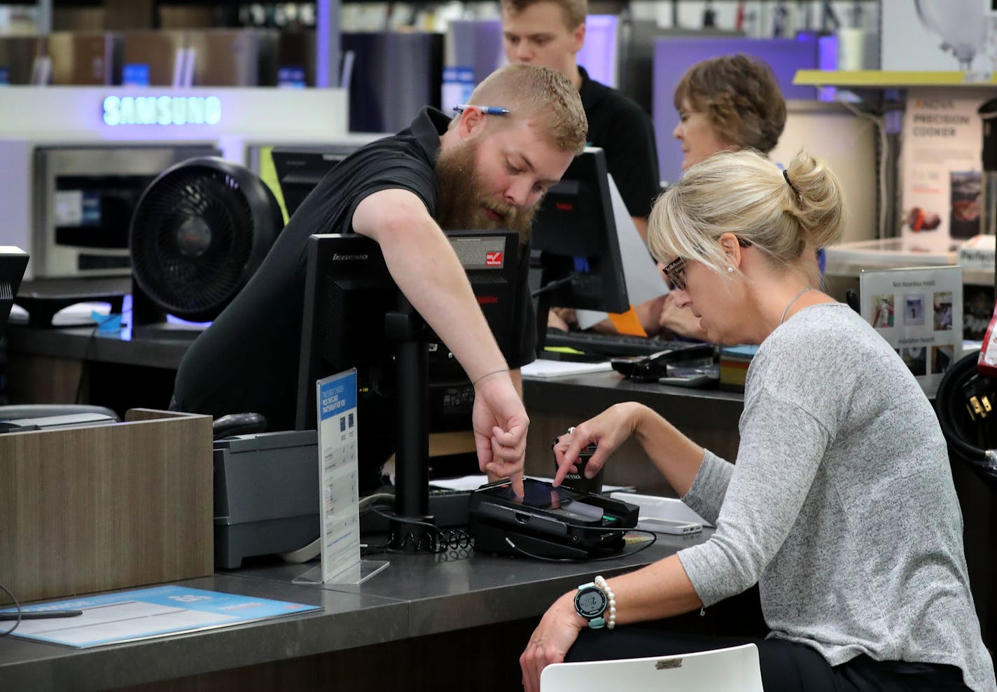 Tom Gagnon who does sale in the Best Buy appliance section, left, helps customer Heather Bjorneberg of Chanhassen as she schedules a delivery for a new refrigerator and dishwasher she purchase Tuesday, Aug. 23, 2016, in Eden Prairie, MN.](DAVID JOLES/STARTRIBUNE)djoles@startribune Second quarter earnings reports were in Tuesday and Best Buy exceeded expectations.** Heather Bjorneberg,Tom Gagnon, cq