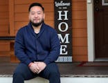 DFL Rep. Fue Lee, seen outside his North Minneapolis home on Sept. 16, said 20 members of his family came down with COVID-19 after a family wake last 