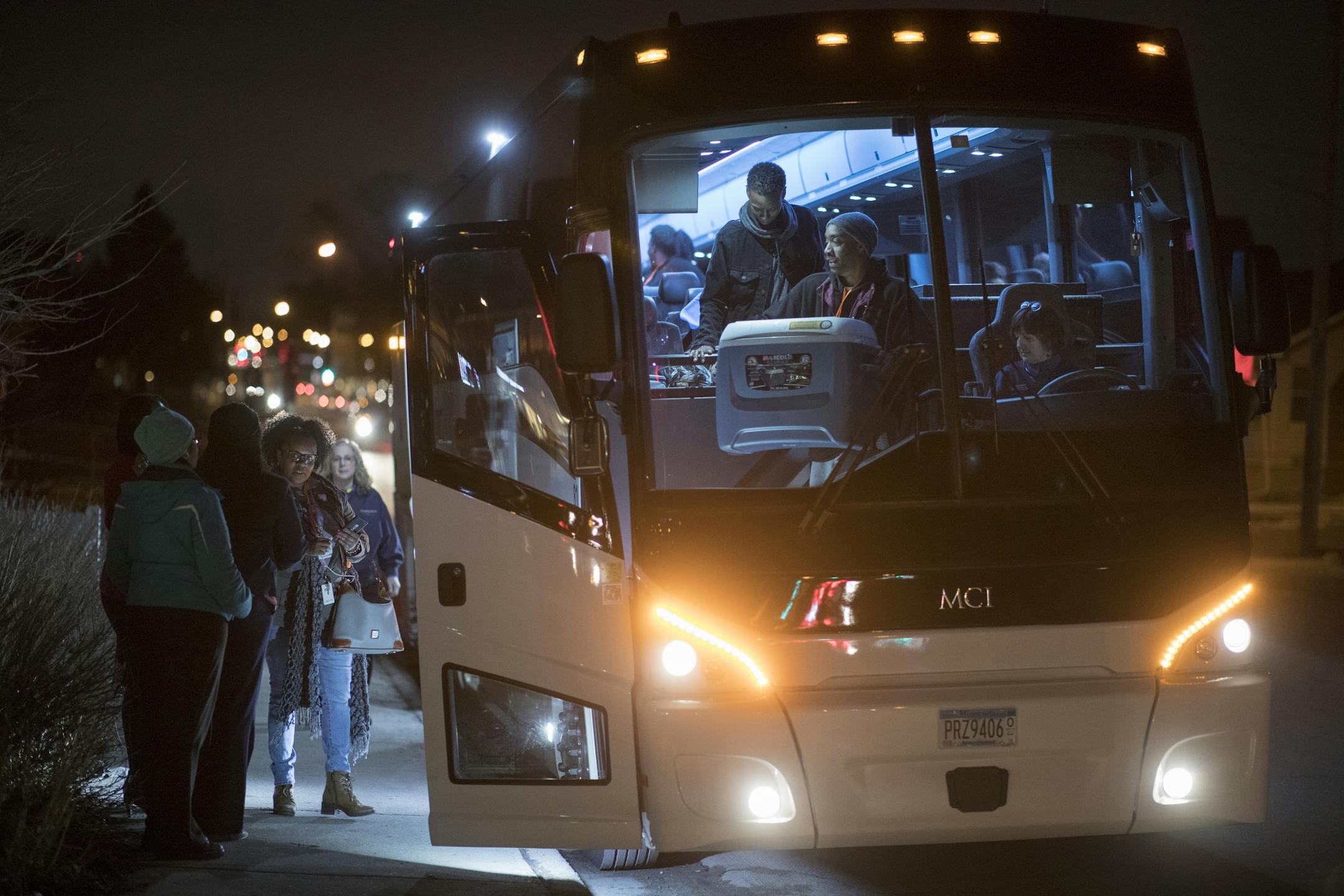 Parents saw off students who gathered at the Northside Achievement Zone and boarded a bus for Washington D.C., Wednesday, March 21.