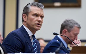 Secretary of Defense Pete Hegseth, joined by Gen. Dan Caine, chairman of the Joint Chiefs of Staff, right, fields questions on the Pentagon budget fro