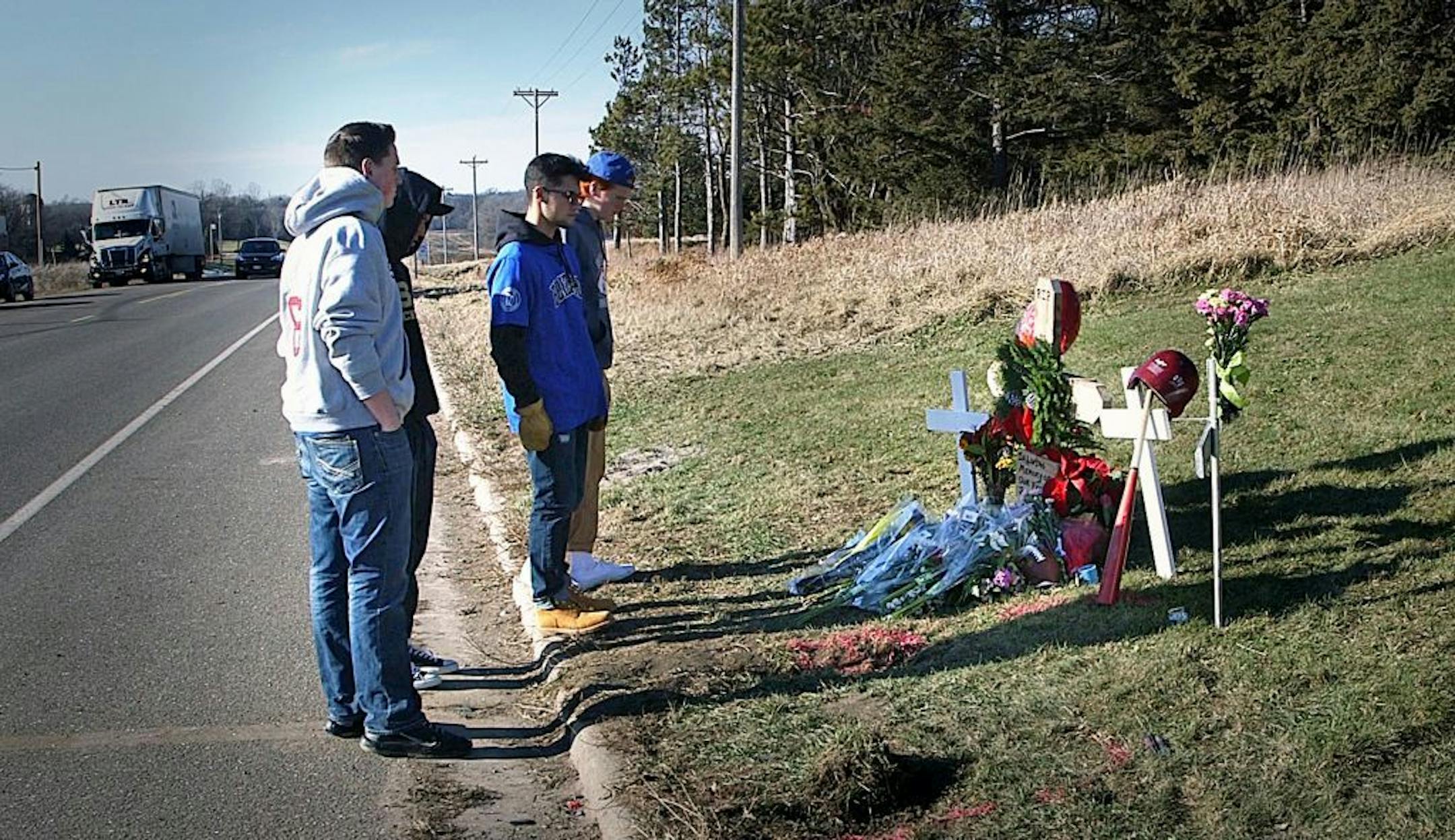 Lakeville South High School senior Soda Simphilavong pays his respects at the site of the Lakeville crash that killed two students.