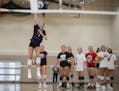 Olivia Tjernagel served the ball during the first day of volleyball practice Monday at Mayer Lutheran High School. Photo: Jerry Holt • Jerry.holt@st