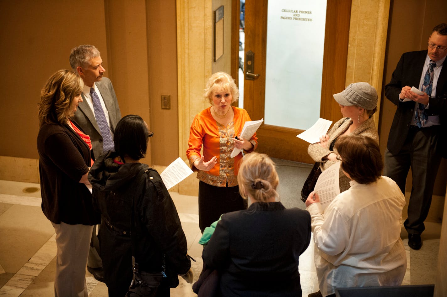 Jennifer Munt of AFSCME talked to daycare providers in February before going into a press conference to support the Child Care Collective bargaining Act.