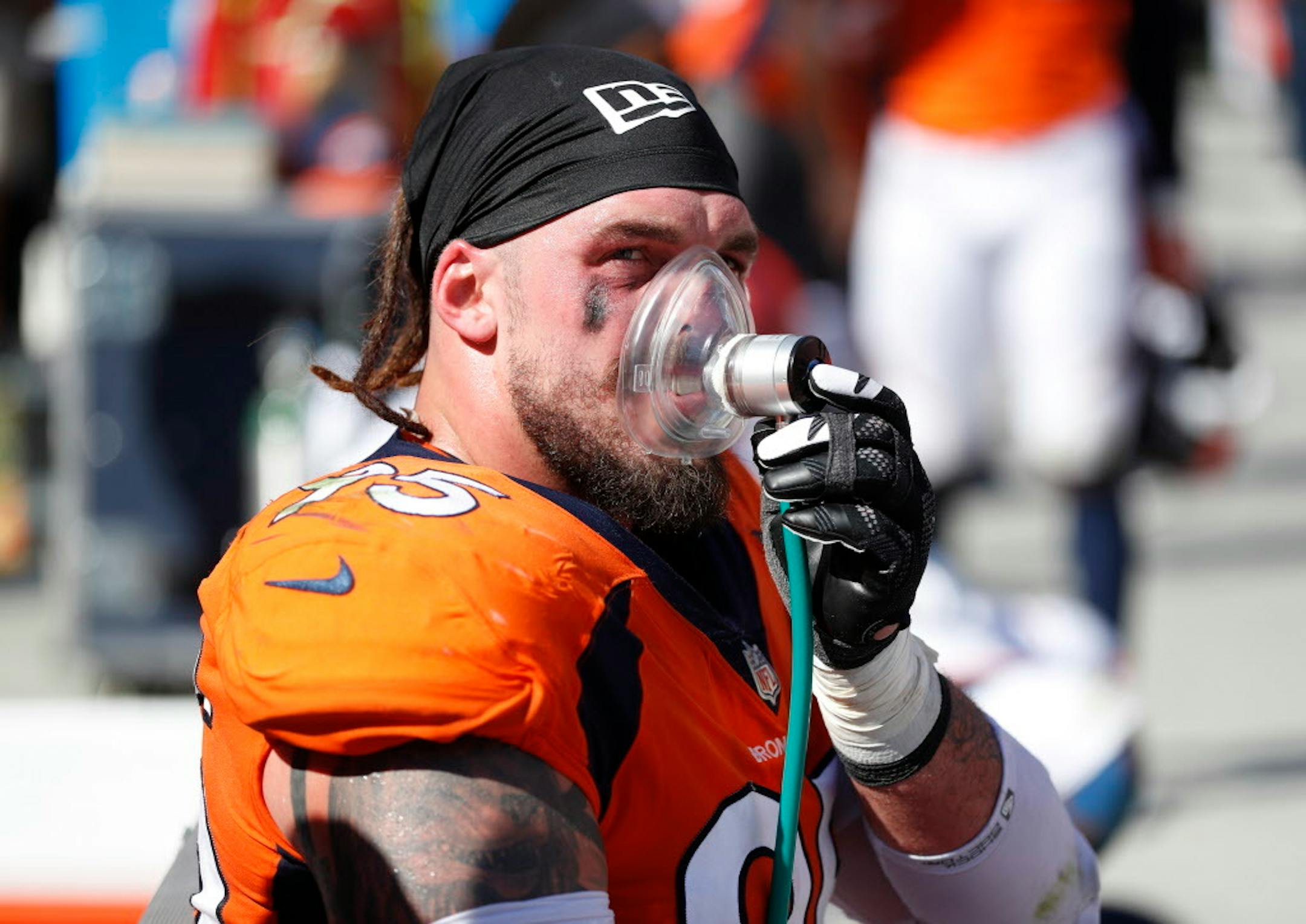 Denver Broncos defensive end Derek Wolfe (95) gets oxygen during the first half of an NFL football game against the Oakland Raiders, Sunday, Sept. 16, 2018, in Denver.