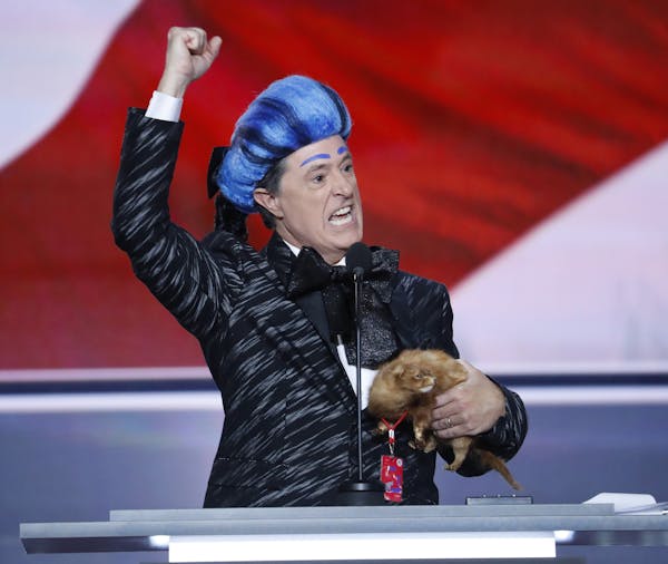 Comedian Stephen Colbert clowns around on the stage at the Republican National Convention in Cleveland, Sunday, July 17, 2016. (AP Photo/J. Scott Appl