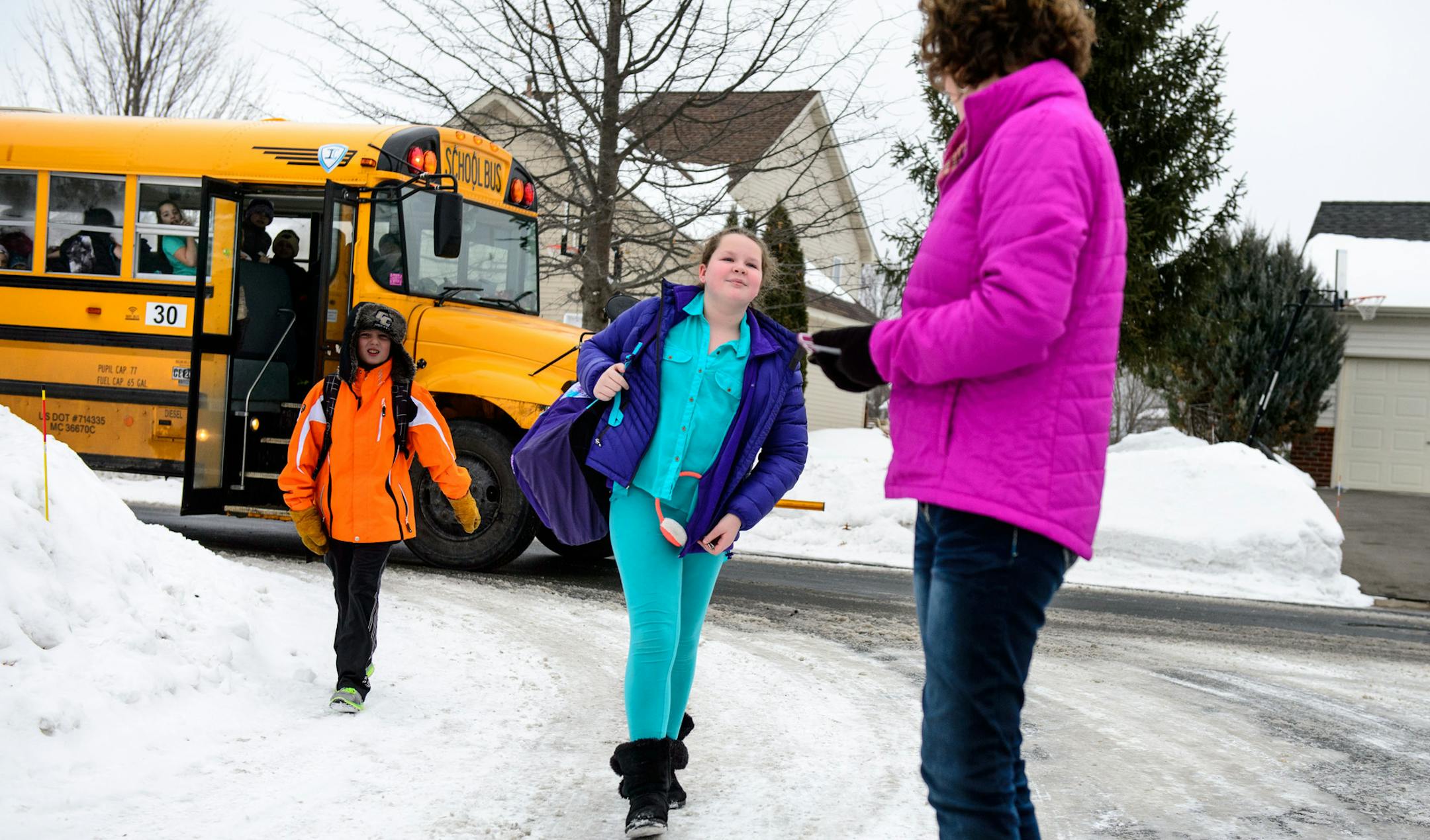 Michelle Aspelin, with the app fired up on her cellphone, met her fifth-grade daughter, Sarah, as she got off the bus.
