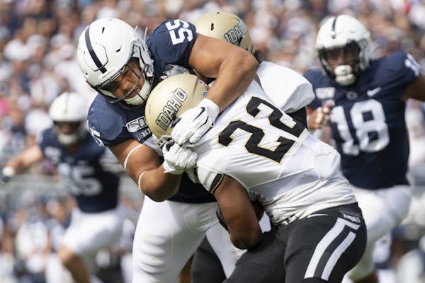 Penn State defensive tackle Antonio Shelton (55) tackles Idaho running back Aundre Carter (22) in the first quarter of a game in August. Shelton has b