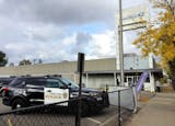 A police vehicle is parked outside of a United States Postal Service office, located at 1715 Seventh Street West in St. Paul, on Sunday, Oct. 13, 2024. ] NICOLE NORFLEET • nicole.norfleet@startribune.com