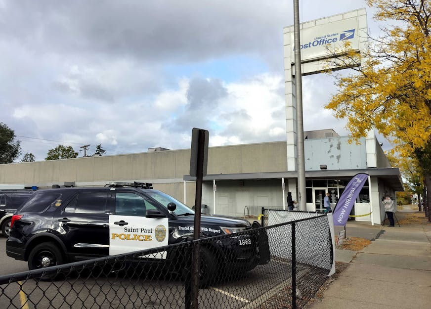 A police vehicle is parked outside of a United States Postal Service office, located at 1715 Seventh Street West in St. Paul, on Sunday, Oct. 13, 2024. ] NICOLE NORFLEET • nicole.norfleet@startribune.com