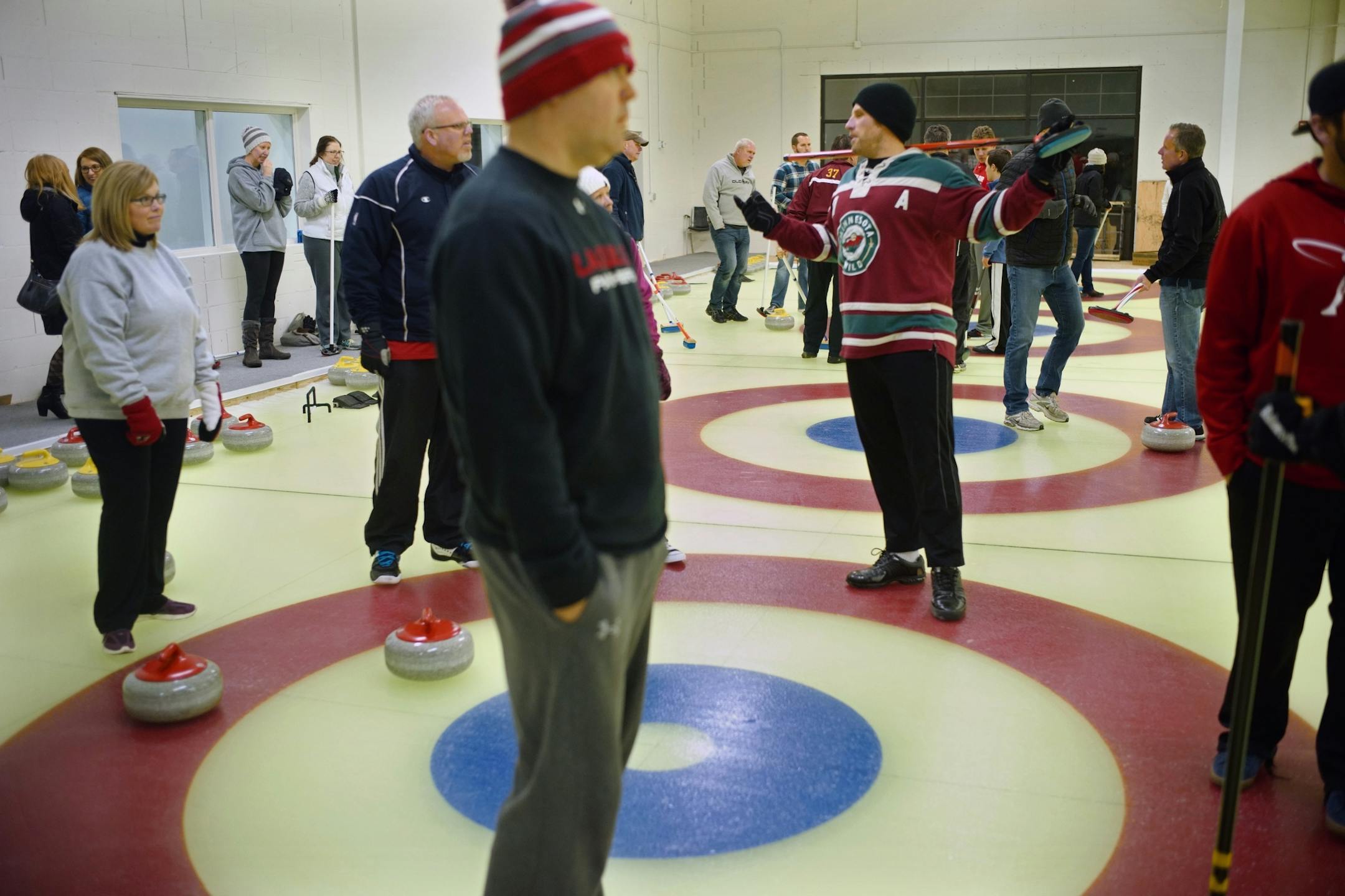 Several dozen people turned out for lessons and to experience how to curl..