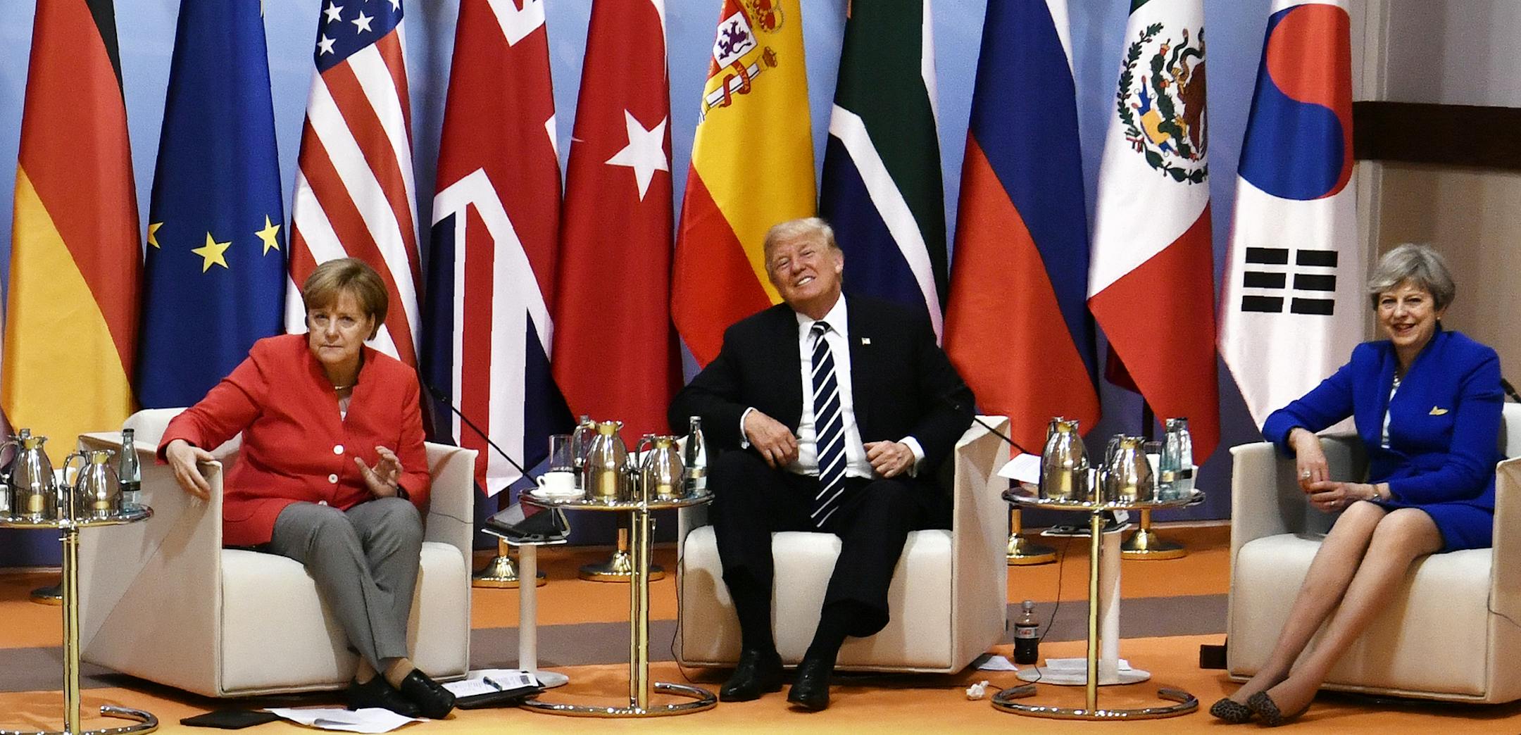 From left: Argentina's President Mauricio Macri, German Chancellor Angela Merkel, US President Donald Trump and Britain's Prime Minister Theresa May attend the "retreat meeting" on the first day of the G-20 summit in Hamburg, northern Germany, on Friday July 7, 2017. Leaders of the world's top economies will gather from July 7 to 8, 2017. (John MacDougall/Pool Photo via AP) ORG XMIT: MIN2017071011425411