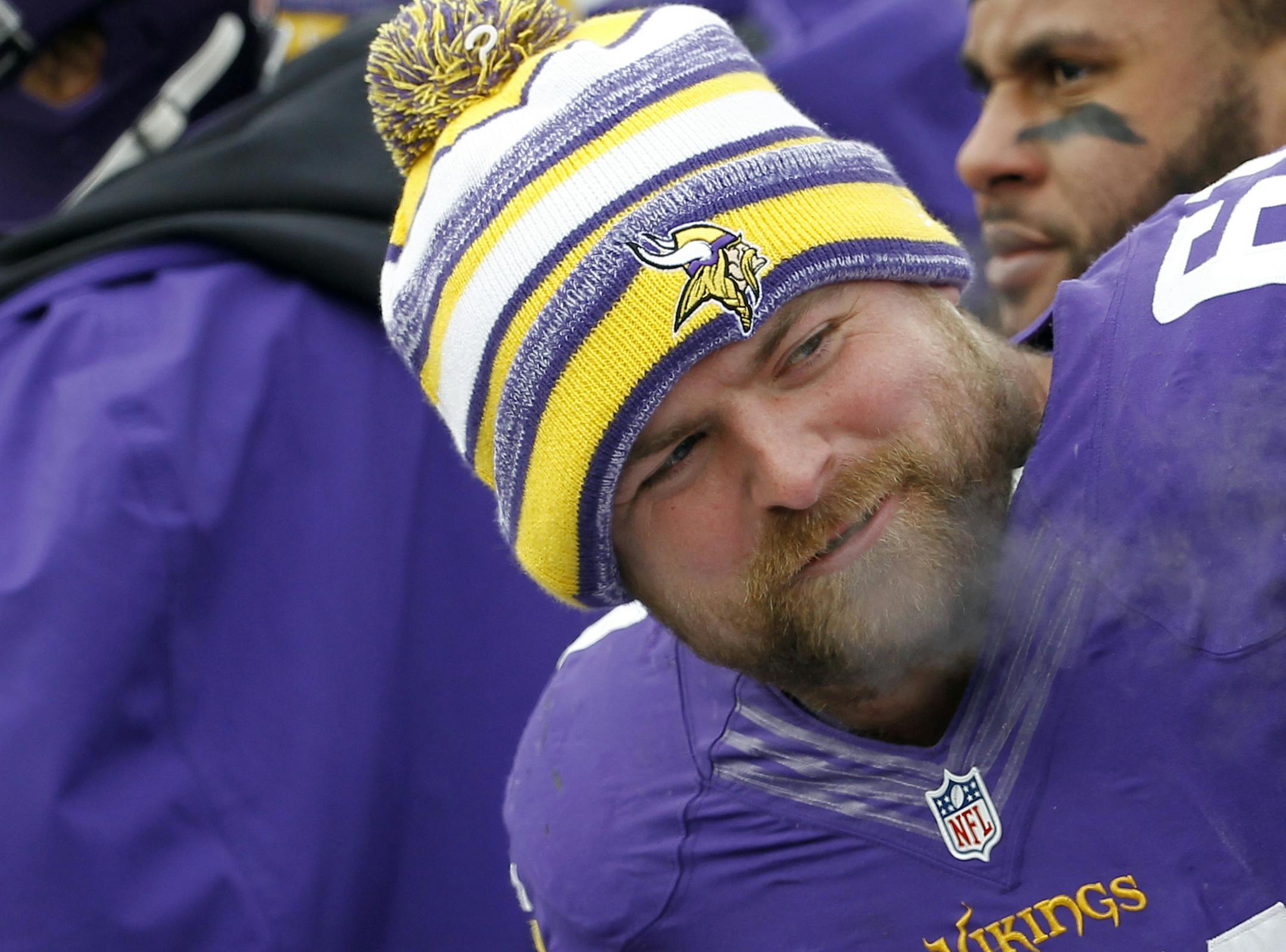 Minnesota Vikings guard Joe Berger (61) talks with teammate John Sullivan, right, during the first half of an NFL football game against the Carolina Panthers, Sunday, Nov. 30, 2014, in Minneapolis. (AP Photo/Ann Heisenfelt) ORG XMIT: MNCN1
