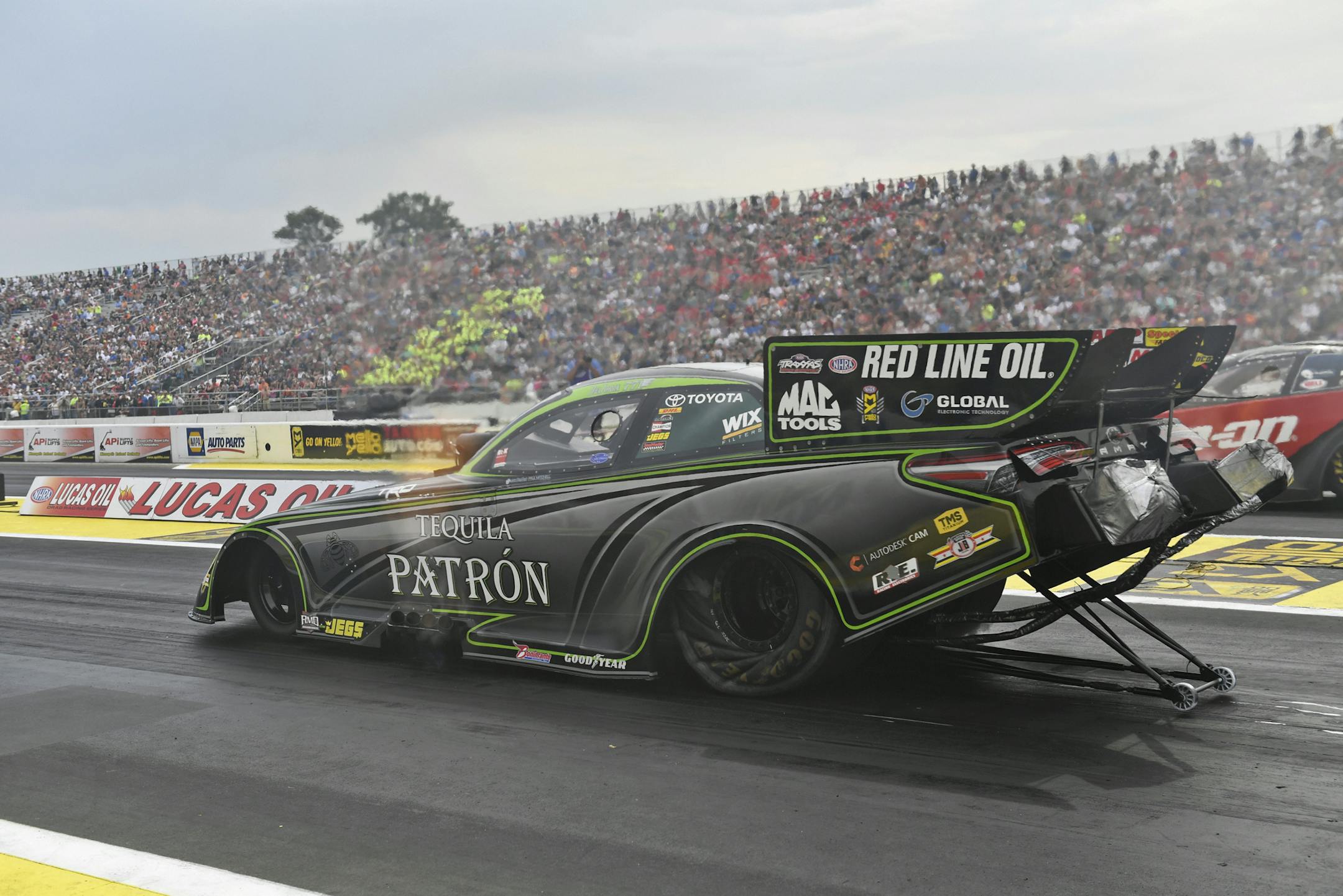 In this photo provided by NHRA, Alexis DeJoria drives in Funny Car competition at the Lucas Oil NHRA Nationals drag races at Brainerd International Raceway on Sunday, Aug. 20, 2017, in Brainerd, Minn. DeJoria defeated Tommy Johnson Jr. in the final. (Jerry Foss/NHRA via AP)