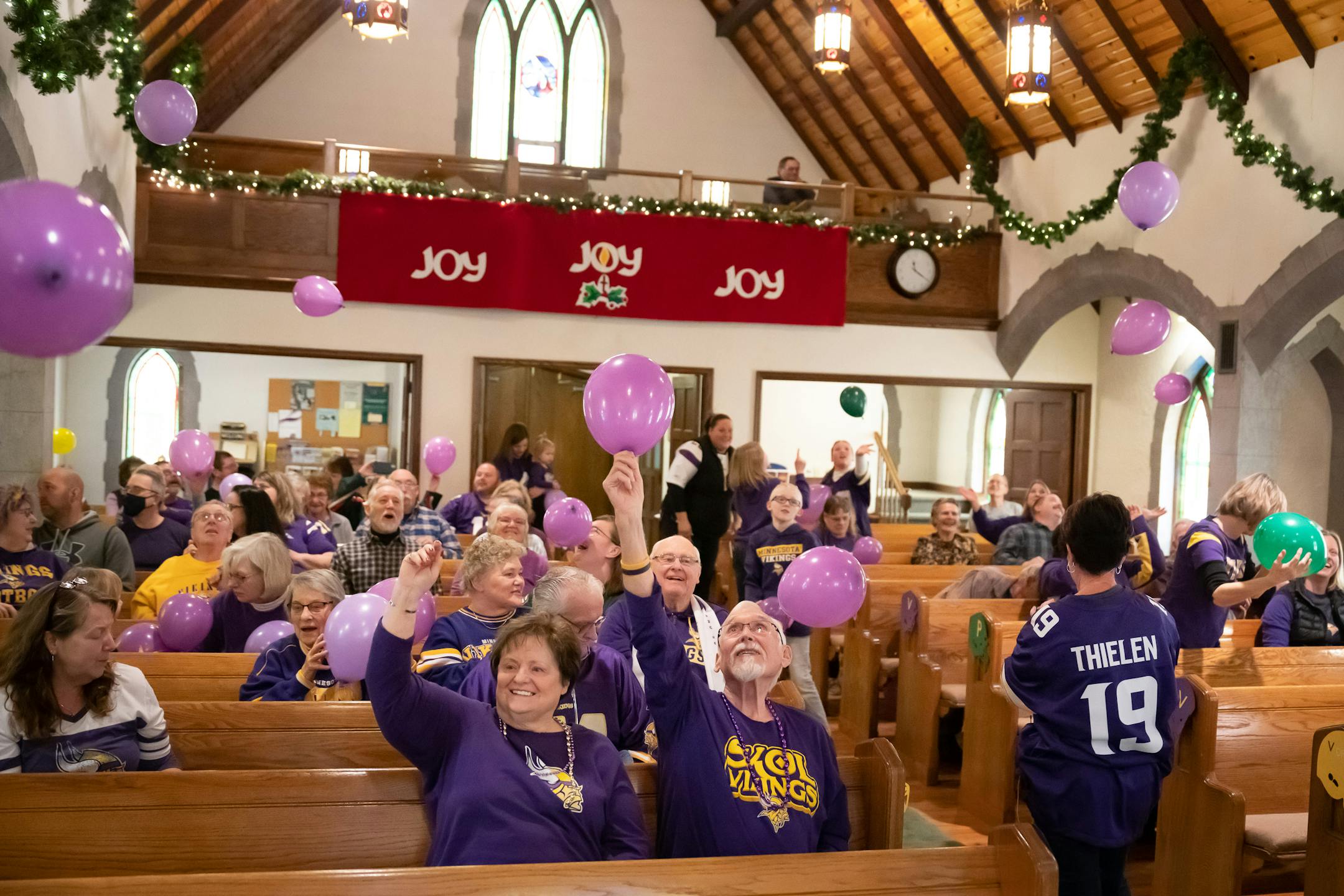Parishoners launched purple, green and yellow balloons toward the end of the service as musical director Steve Berggren sang.