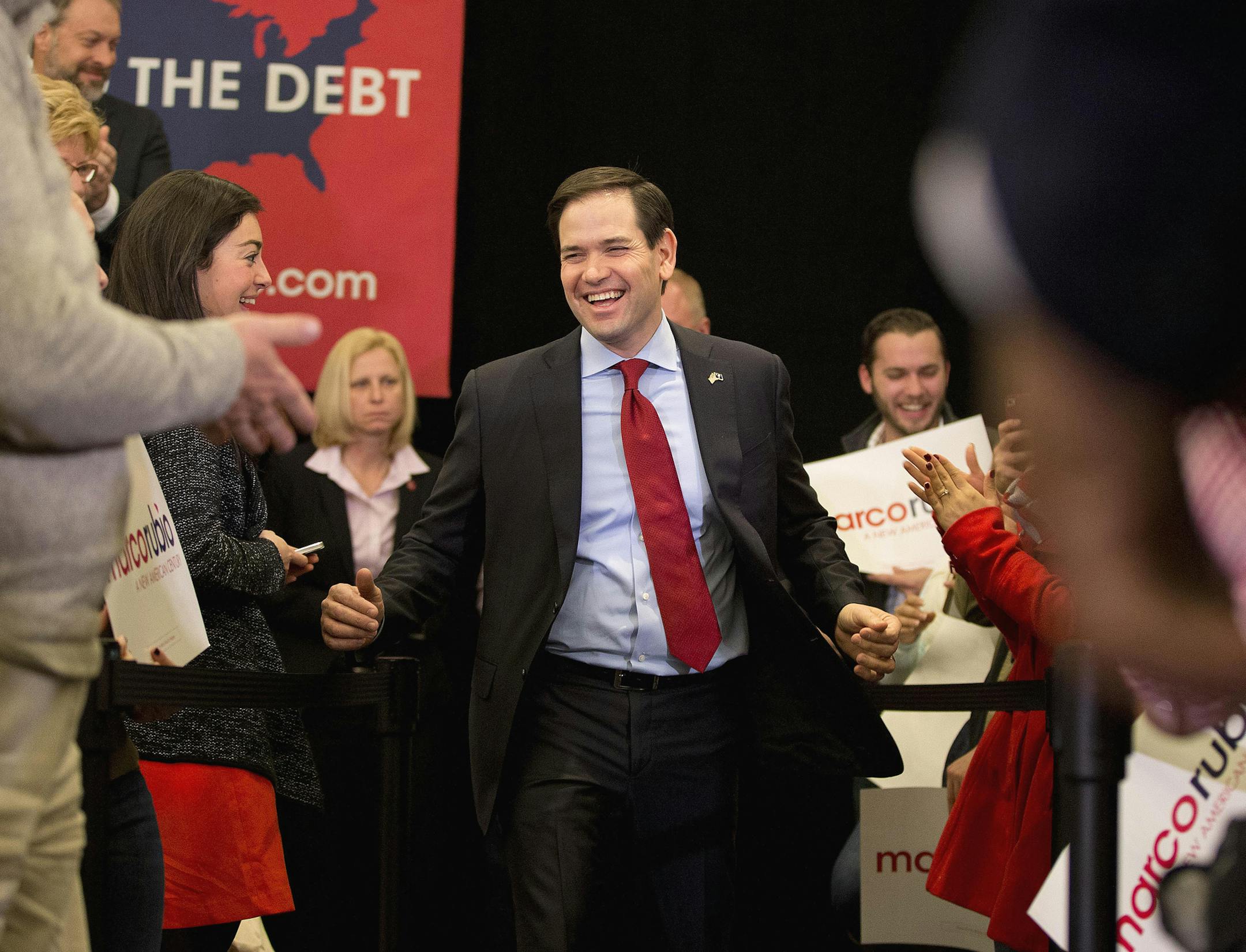 Republican presidential candidate, Sen. Marco Rubio, R-Fla. takes the stage for a rally, Friday, Feb. 19, 2016, in Columbia, S.C. An election watchdog organization filed a complaint Friday with the Federal Election Commission over a $500,000 donation to a super political action committee aiding Marco Rubio from a mystery firm headed by a New York investor. Efforts by good government groups to stem the use of shadowy corporate entities to channel large political donations have been long stymied b