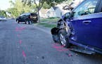 Police say a teenager was killed by a hit-and-run driver in North Minneapolis. Here, parked vehicles that were struck by the hit-and-run driver and se