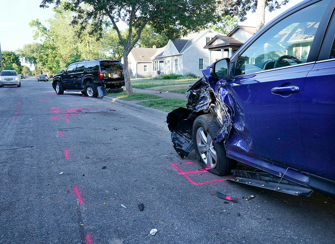 Police say a teenager was killed by a hit-and-run driver in North Minneapolis. Here, parked vehicles that were struck by the hit-and-run driver and seen along Fremont Avenue N. Wednesday in Minneapolis ]