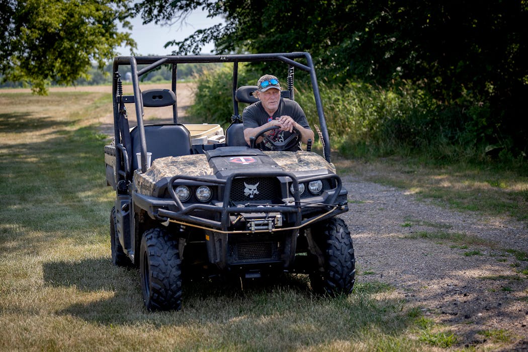 Gladden, in his Bobcat UTV, has plenty of places to roam on his property 30 miles west of the Twin Cities.