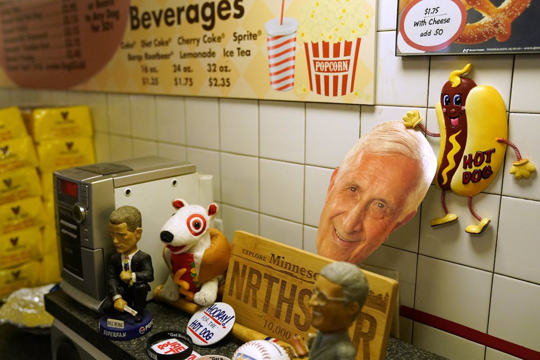 Famous customer Sid Hartman, 99-year-old Star Tribune sportswriter and WCCO Radio personality, watches over the register in bobblehead and face-on-a-stick form.