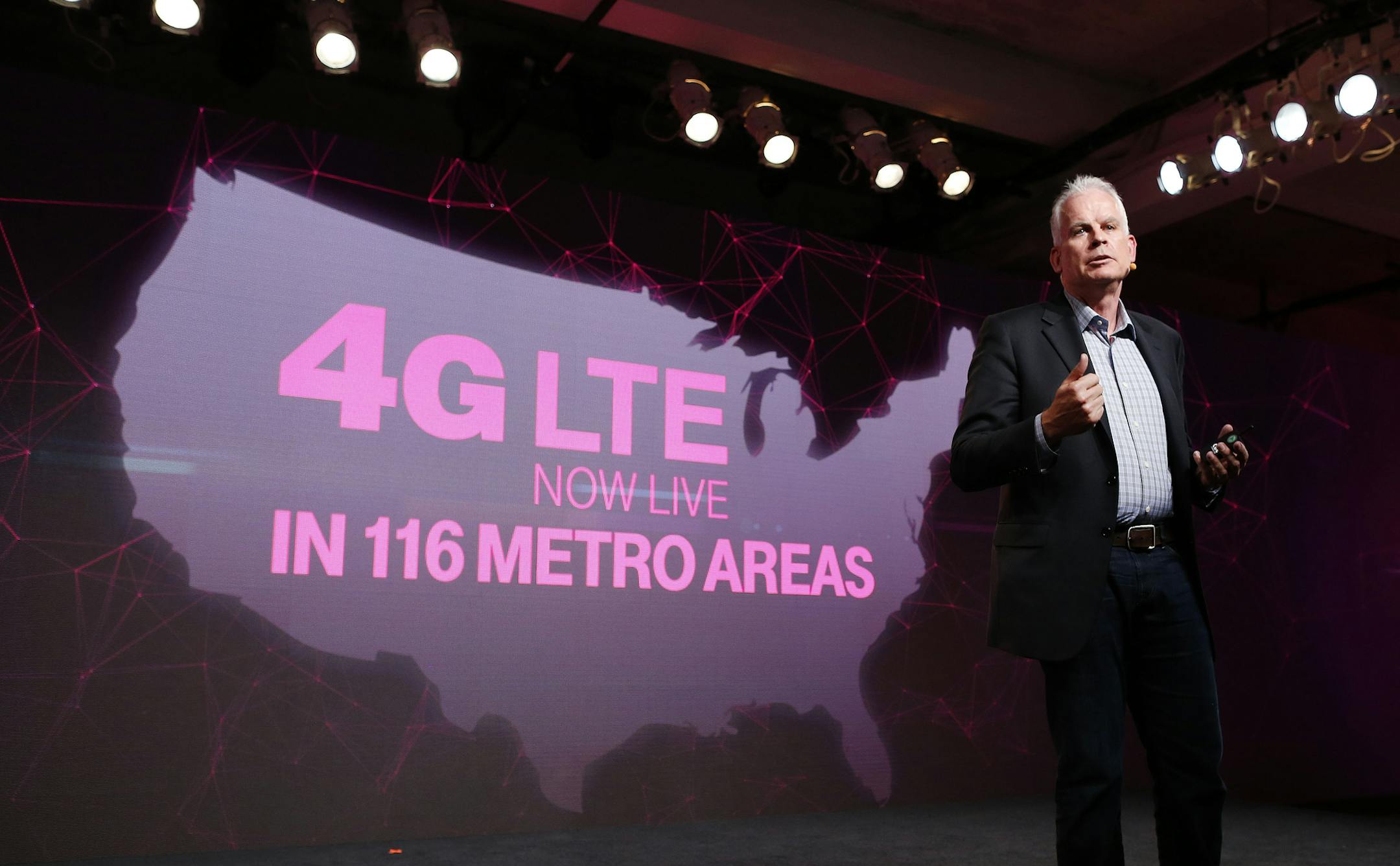 IMAGE DISTRIBUTED FOR T MOBILE - T-Mobile CTO Neville Ray announces the company is providing 4G LTE service covering 157 million people in 116 metro areas, blowing past its 2013 goal of reaching 100 million people during T Mobile's Un-carrier event at Skyline Studios, Wednesday, July 10, 2013, in New York. (John Minchillo/AP Images for T Mobile) ORG XMIT: CPA701