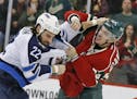 Winnipeg Jets right wing Chris Thorburn (22) and Minnesota Wild right wing Kurtis Gabriel, right, fight during the second period of an NHL hockey game