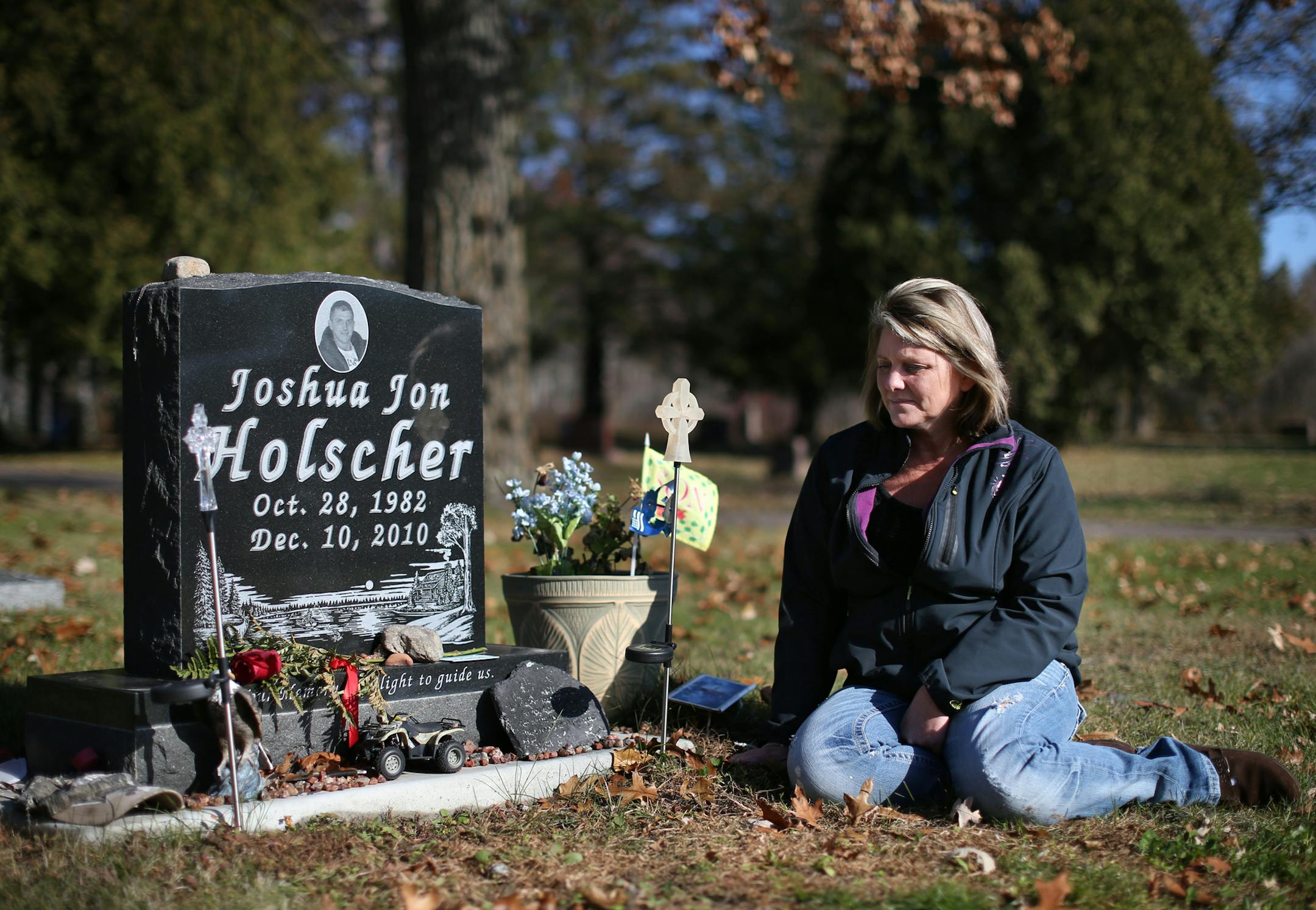 Debbie Kickhafer visited her 28-year-old son, Josh Holscher, at Mount Pleasant Cemetery in Onamia, Minn. Holscher committed suicide in jail custody in December 2010 after his mother warned Mille Lacs County officials of Hoscher's depression and previous suicide attempt. ] MCKENNA EWEN / Star Tribune * mckenna.ewen@startribune.com