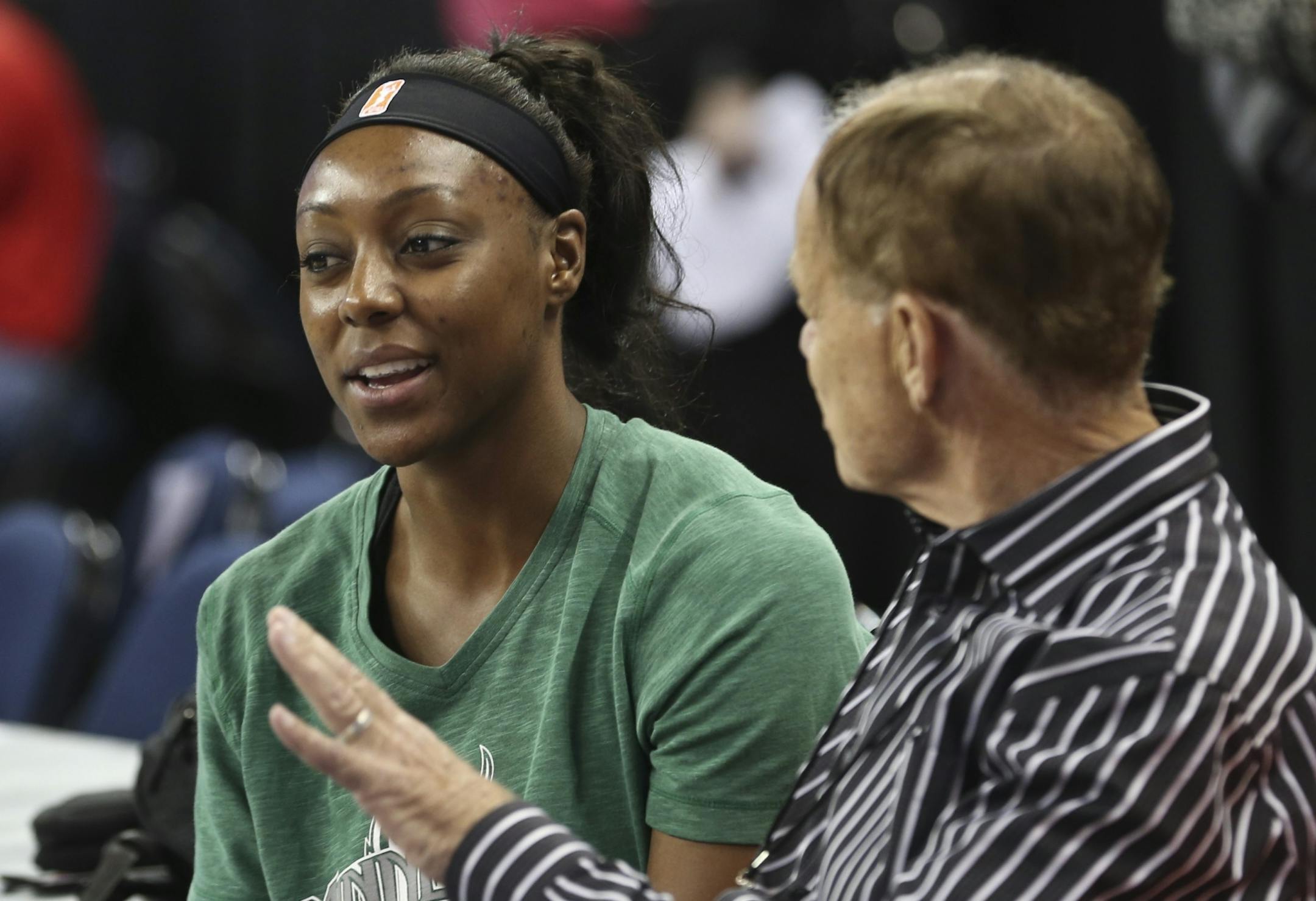 Monica Wright #22 of the Minnesota Lynx talks with team owner Glen Taylor during warmups for Game 3 of the WNBA finals between the Minnesota Lynx and the Atlanta Dream on Thursday, October 10, 2013, at the Gwinnett Center in Duluth, Ga.