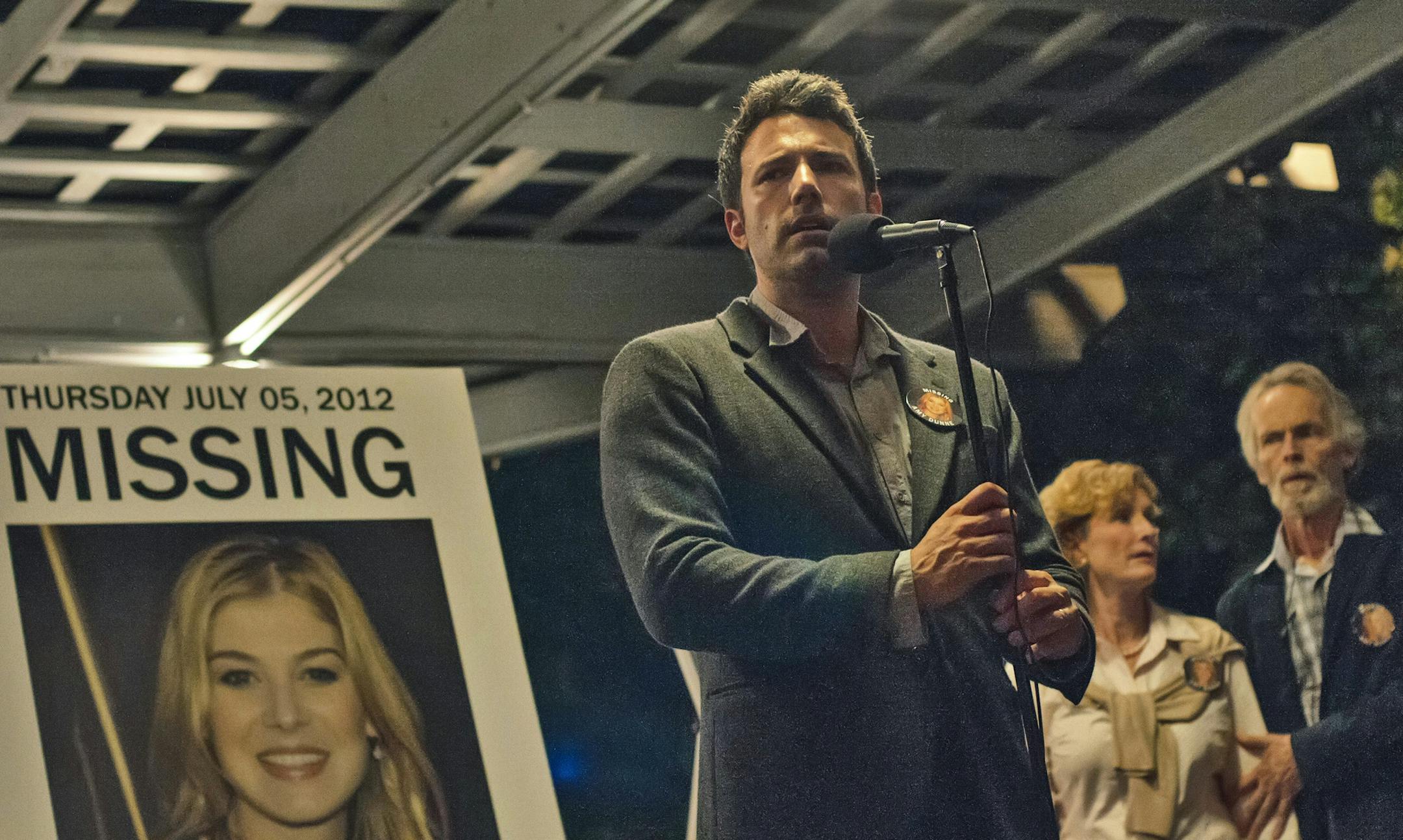 This image released by 20th Century Fox shows, from left, Ben Affleck, Lisa Barnes and David Clennon in a scene from "Gone Girl." The film, based on the best-selling novel, will release on Oct. 3. (AP Photo/20th Century Fox, Merrick Morton)