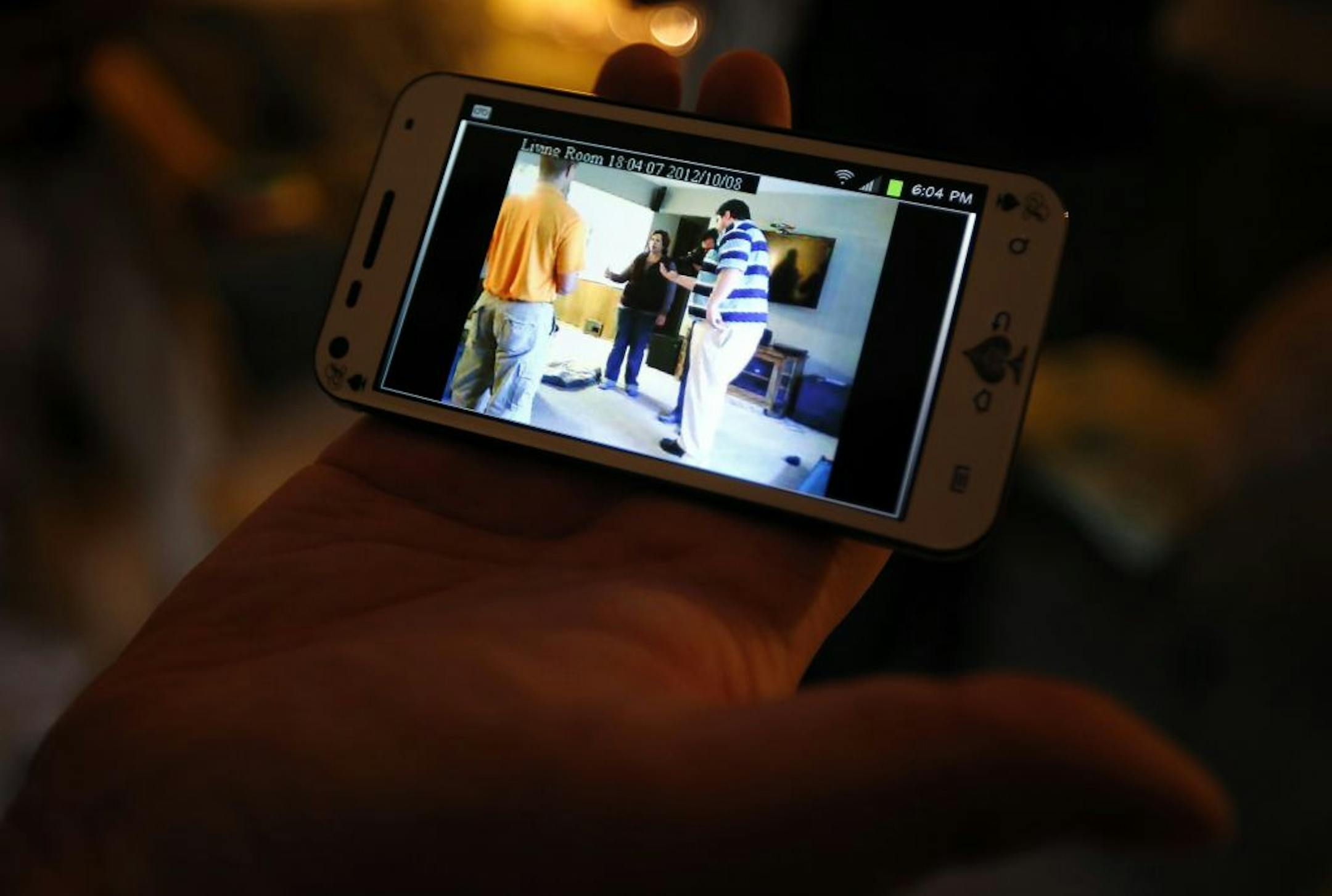 Brian Smiley of Brooklyn Center demonstrated how he can view the security camera in his home through his smart phone.