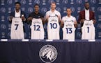 The new Timberwolves players introduced at a news conference Tuesday held up their jerseys for a photo opportunity. They are, from left, Jordan Bell, 