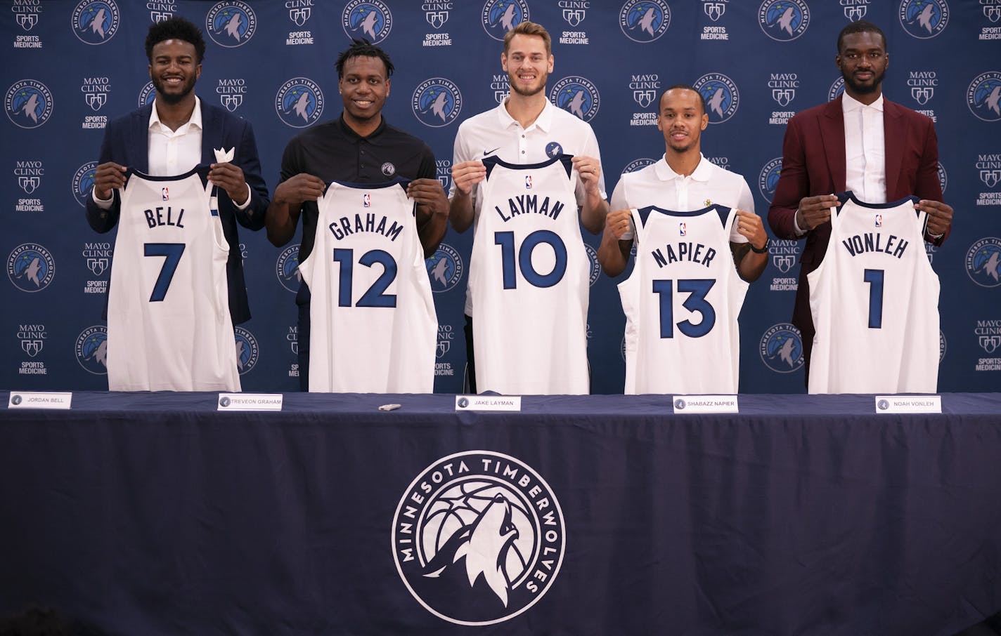 The new Timberwolves players introduced at a news conference Tuesday held up their jerseys for a photo opportunity. They are, from left, Jordan Bell, Treveon Graham, Jake Layman, Shabazz Napier, and Noah Vonleh. ] JEFF WHEELER &#x2022; jeff.wheeler@startribune.com The Minnesota Timberwolves introduced a gaggle of new players at a news conference Tuesday afternoon, July 23, 2019 held at their Mayo Clinic Square Courts.