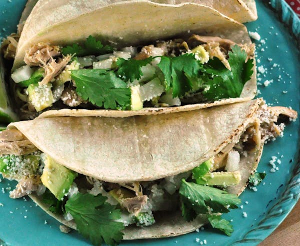 Slow Cooker Green Chile Chicken Tacos.