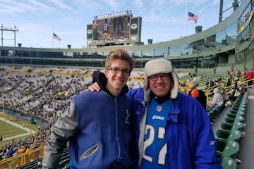 Radio host Dan Cole and his son, “Deuce,” took in a Lions-Packers game at Lambeau Field.